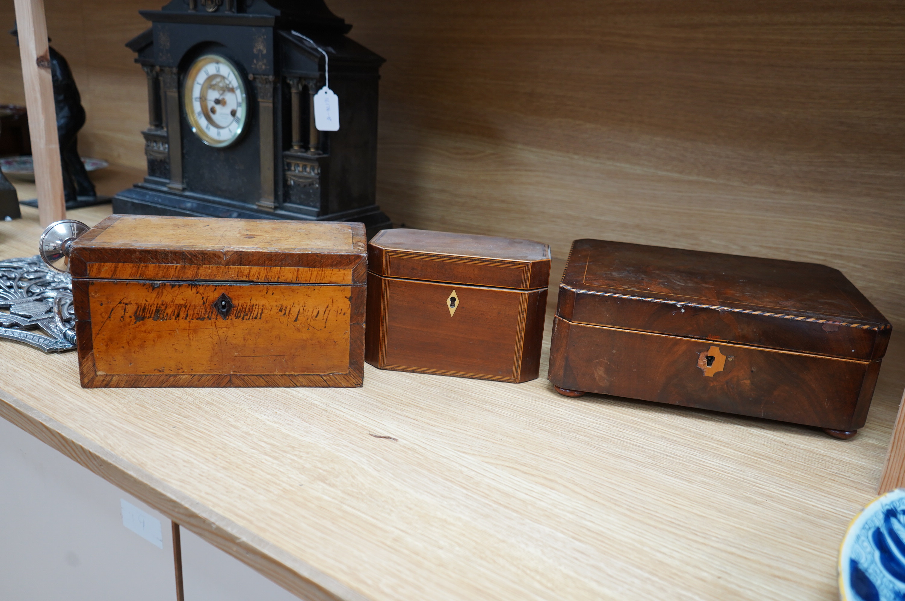 A 19th century mahogany work box and two tea caddies, largest work box 29cm wide, 20cm deep (3). Condition - poor to fair